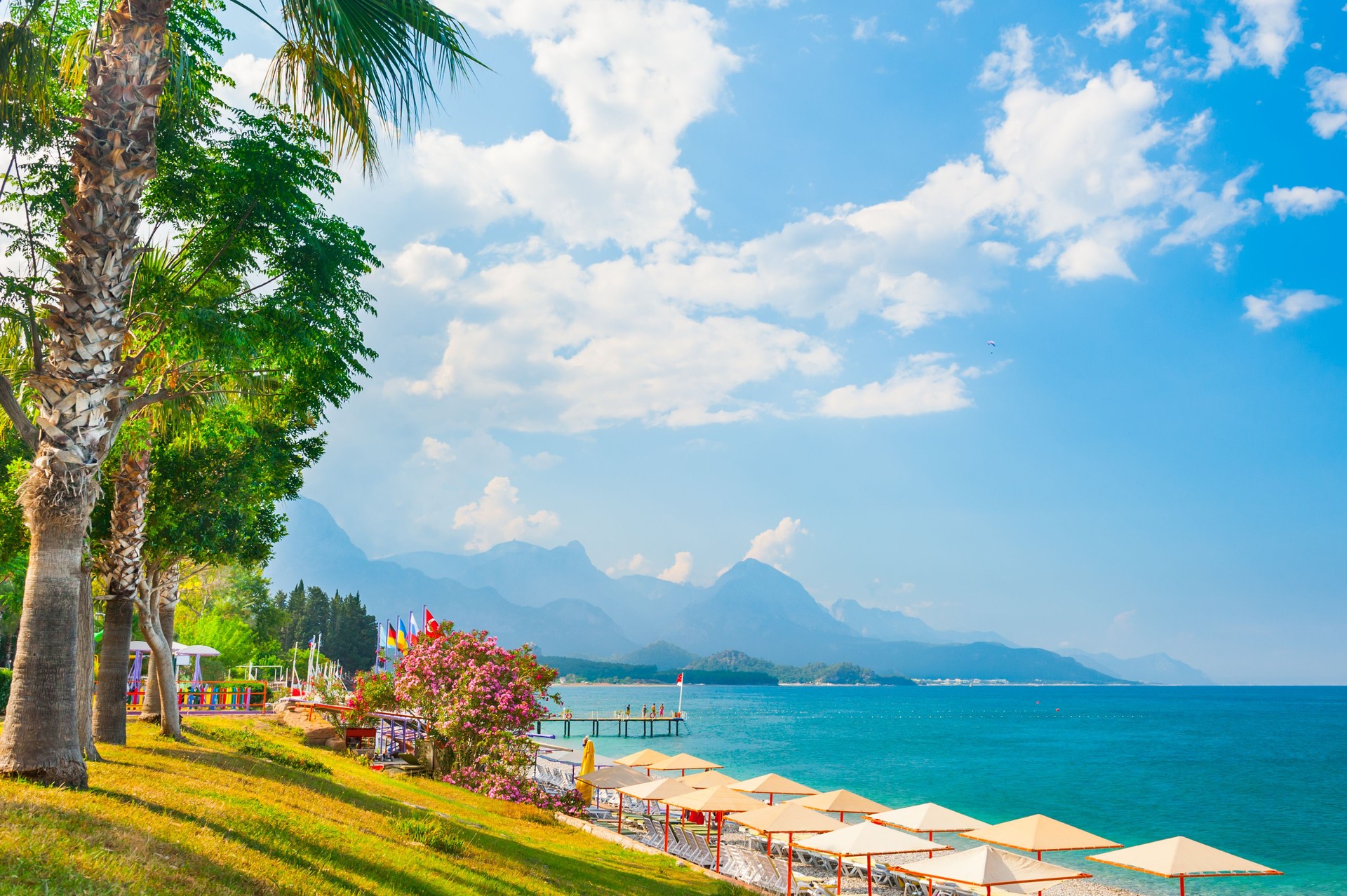 Beautiful beach with green trees in Kemer, Turkey.